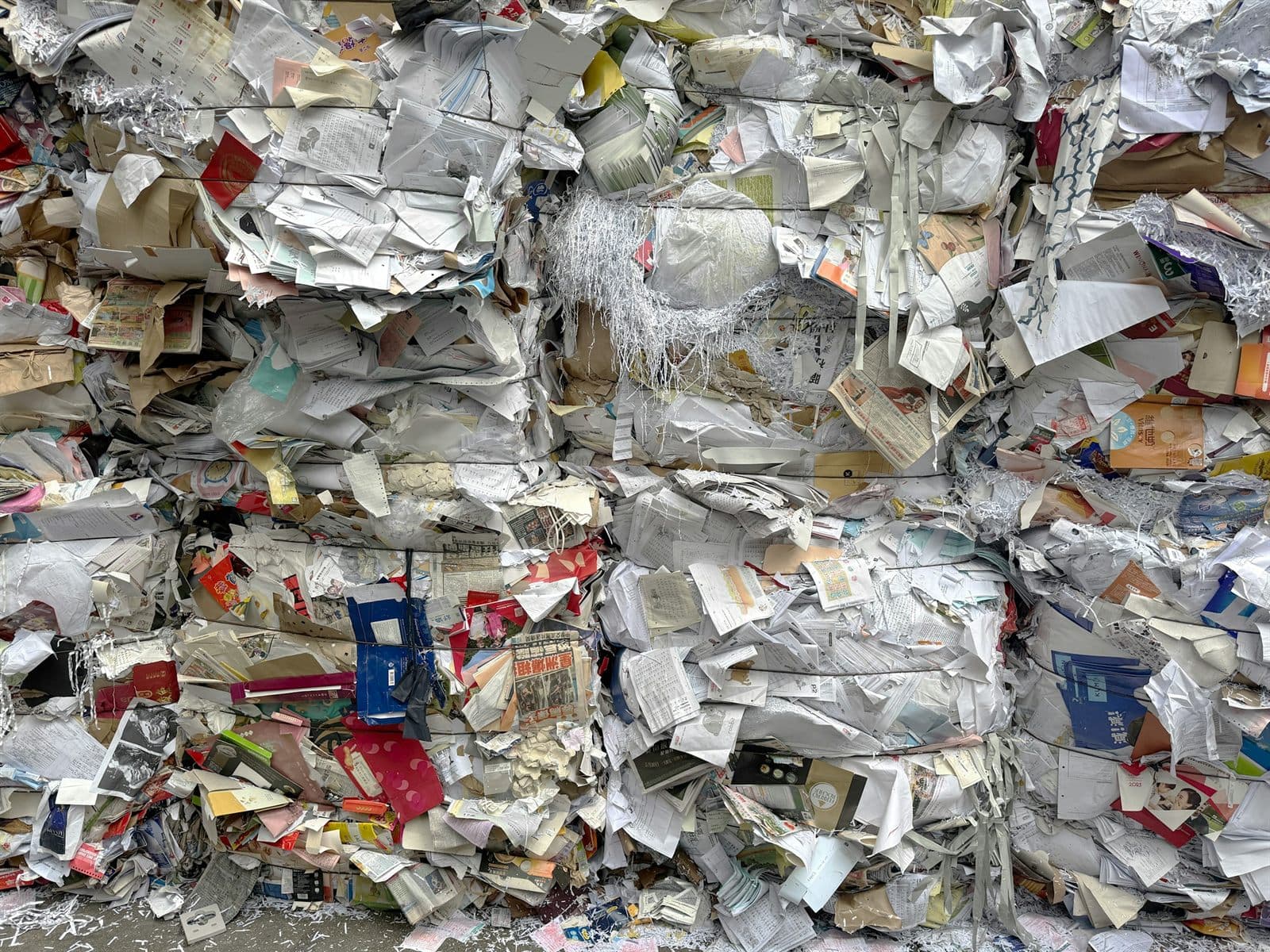 Compressed bales of mixed paper and cardboard